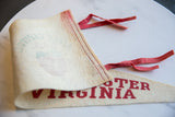 Detail of cream vintage felt pennant with red 