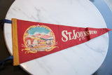 Vintage St. Johnsbury VT felt pennant, vibrant red with colorful landscape graphic and gold binding.