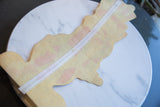 Aged texture and stitched center seam on the back of the vintage felt flag.