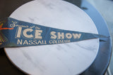 Vintage Ice Show felt flag showing light creases and worn retro text from an angle.