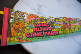 Detailed view of the vintage pennant's retro cartoon graphics, including a lion and smiling sun.