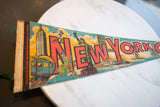 Vintage New York City felt pennant detail, Empire State, subway, and borough text.