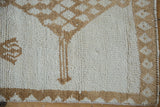 Distressed pile detail: ivory and pale coffee brown diamond checkered pattern.