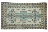Distressed vintage Oushak carpet, ivory and powder blue shield medallion, 5' x 8'5