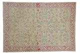 Vintage distressed Sparta rug with an allover floral design in soft lime green, pink, and powder blue.