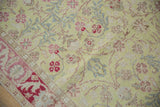 Even wear down to the knot heads on a vintage Sparta rug with a soft floral design.