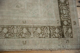 Geometric relief border with finned plants and short pile on a vintage distressed Oushak.