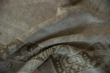 The pliable, hand-knotted weave and short pile texture of a distressed vintage Oushak carpet.