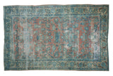 Distressed vintage Lilihan carpet in dusty peach with powder blue floral patterns, 6'2