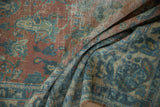 Textured distressed Lilihan carpet pile showing soft peach, blue, and foundation areas.