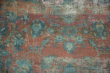 Distressed Lilihan carpet pile with floral botehs in dusty peach and powder blue.