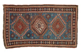 Caucasian rug, indigo blue, madder red triple medallions, mostly even wear.