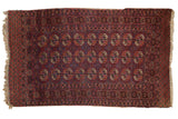 Vintage Turkmen rug, repeating floral guls, brown, fuchsia, navy, ivory borders, 3'9