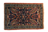 Fine vintage Persian Dargezine rug with detailed floral bouquets, cobalt blue, and brick red.