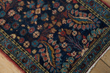Vintage Dargezine rug's cobalt blue field, brick red floral motifs, visible wear, and selvage.