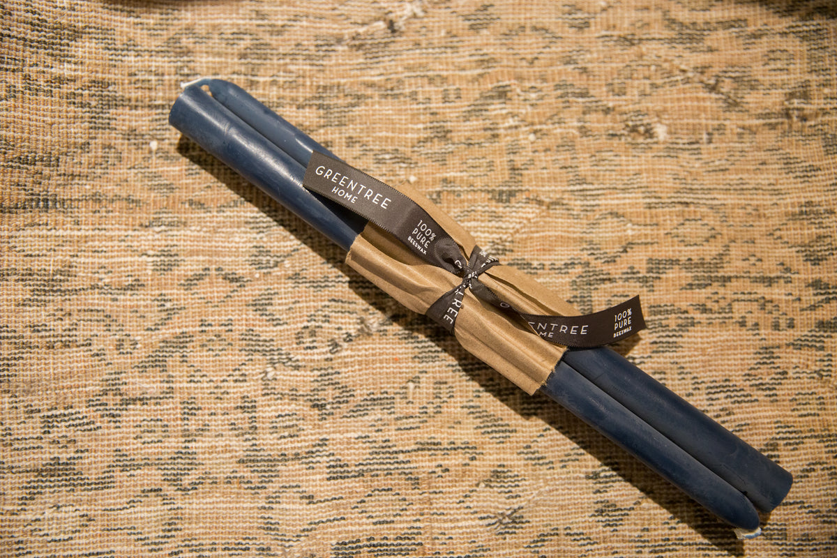 A pair of 12-inch Blue Slate beeswax taper candles bundled with a branded ribbon.