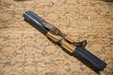A pair of 12-inch Blue Slate beeswax taper candles bundled with a branded ribbon.