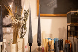 Pair of tall black beeswax cone taper candles with a textured finish, 14 inches high.