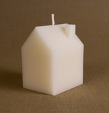 Large cream beeswax house candle with chimney detail and visible wick.