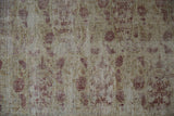 Antique Kerman rug with distressed pile, visible foundation.