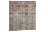 Antique Kerman fragment, distressed millefleur, floral vines in cochineal red, dusty navy, and ivory.