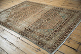 Distressed Hamadan rug showing Herati motif, Samovar border, and worn texture.