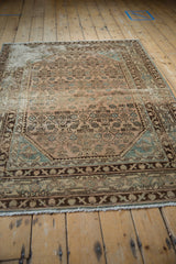 Distressed Hamadan rug detail: worn Herati motif, Samovar border, dusty rose and blue.