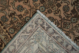 Distressed vintage Hamadan rug pile with Herati motif, visible wear, hand-knotted reverse, and fringe.