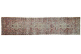 Antique distressed Kerman runner with triple medallions, red and blue floral motifs. 2'4