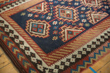 Vintage Persian Kilim rug side border with geometric floral motifs and intact dark brown selvage.