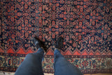 A view of the hand-knotted texture and Herati pattern on a vintage Malayer rug showing its characteristic even wear.