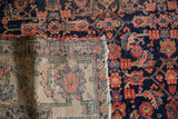 Hand-knotted construction detail of a vintage Malayer carpet showing the foundation and pile.