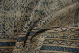 Worn blue Herati field and geometric border detail on a vintage Caucasian rug.