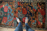 Hand-knotted Antique Bijar rug detail, unusual Karabagh floral motifs in cherry red and navy blue.
