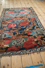 Bijar rug detail: intricate Karabagh design, cherry red roses, and ornate Rococo cartouches.