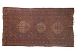 Antique Qashqai carpet, three stepped medallions on a worn madder red field.