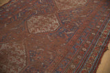 Worn pile detail of Antique Qashqai carpet's madder red field with visible foundation.