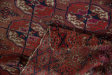 Vintage Turkmen rug with geometric gul pile and contrasting woven lattice reverse.