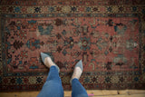 Detail of vintage Persian Lilihan rug showing dusty rose field and geometric crab border pattern.