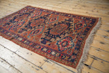 Textural Soumac flatweave showcasing geometric medallions and unique pawn border elements.