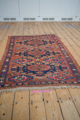 Natural fringe and reciprocating wave border on a hand woven Antique Caucasian Soumac rug.