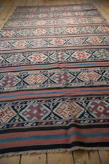 Antique Caucasian flatweave Kilim's geometric serpent and floral motifs in navy, ivory, terracotta hues.