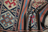 Antique Caucasian Kilim runner with geometric motifs and striped navy, terracotta, and ivory end.