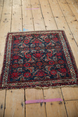 Vintage Hamadan rug featuring intricate navy, tomato red Herati motif and banded ivory borders.