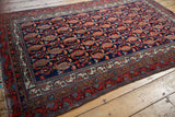 Fine Hamadan rug corner with red fringe, original selvage, and patterned geometric borders.