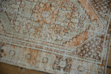 Close view of a vintage Oushak rug's mostly even wear showing the exposed foundation and texture.