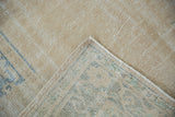 Hand-knotted foundation and secured side cord of a distressed vintage Oushak rug.