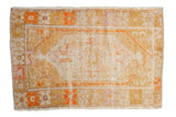 Vintage Distressed Oushak rug featuring unusual saffron, tangerine, ivory, and pale violet lozenge medallion.