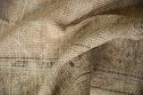 Vintage distressed Oushak rug's low pile with visible knot heads in soft beige and seafoam.