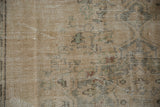 Distressed pile close-up of Oushak rug showing antique ivory, dusty seafoam, and knot head wear.